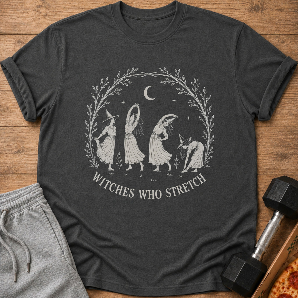 T-shirt with "Witches Who Stretch" text and four witches stretching within a leafy wreath.