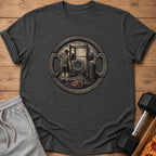 Graphic t-shirt with a weightlifter and gym equipment design within a circular weight plate.