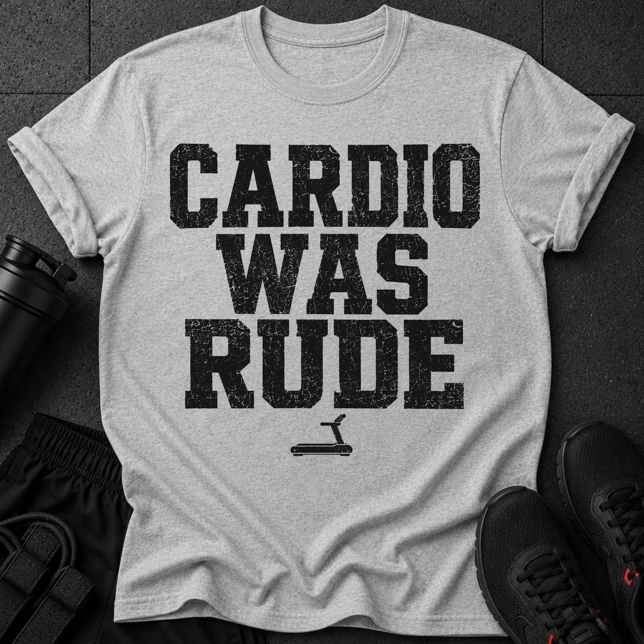 Gray t-shirt with black distressed text "CARDIO WAS RUDE" and treadmill graphic.
