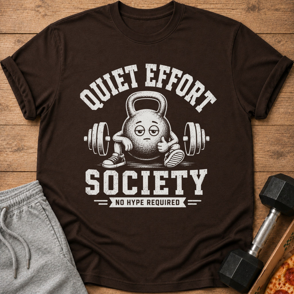 Brown t-shirt with "Quiet Effort Society No Hype Required" text and cartoon kettlebell.