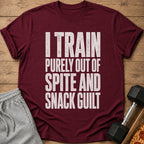 Maroon t-shirt with text "I TRAIN PURELY OUT OF SPITE AND SNACK GUILT".
