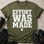 Green t-shirt with white text "EFFORT WAS MADE" and a kettlebell logo.