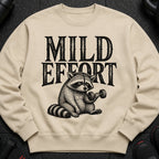 Crewneck sweatshirt with raccoon lifting dumbbell and the text "Mild Effort".