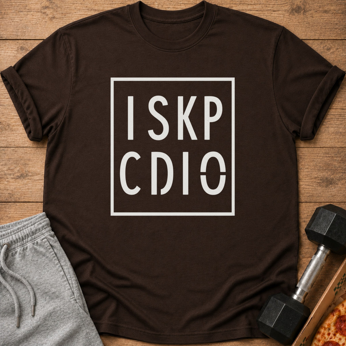 Brown t-shirt with white text "ISKP CDIO" inside a box.