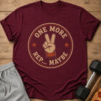 Maroon t-shirt with "ONE MORE REP... MAYBE" and peace sign graphic.