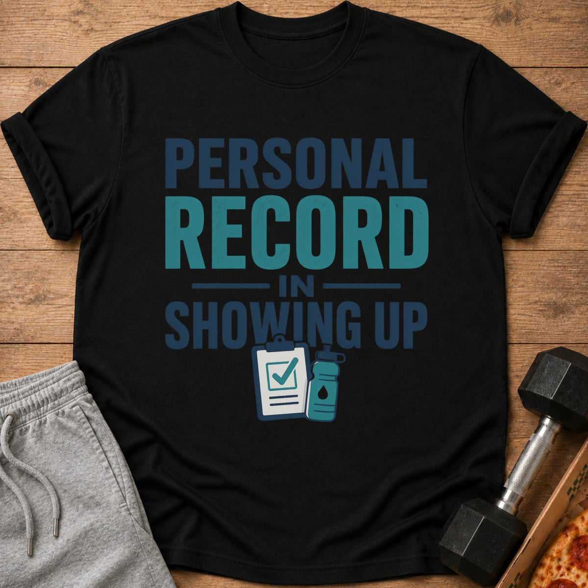 Black t-shirt with "Personal Record In Showing Up" text and gym icons.