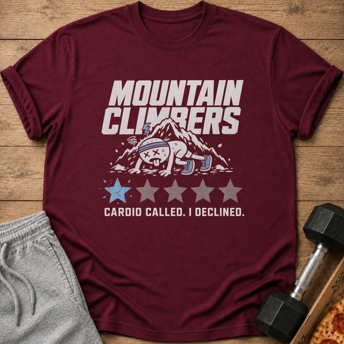 Maroon t-shirt with "Mountain Climbers" text, exhausted cartoon character, and "Cardio Called. I Declined."