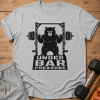 T-shirt graphic of a bear lifting weights with text "UNDER BAR PRESSURE".