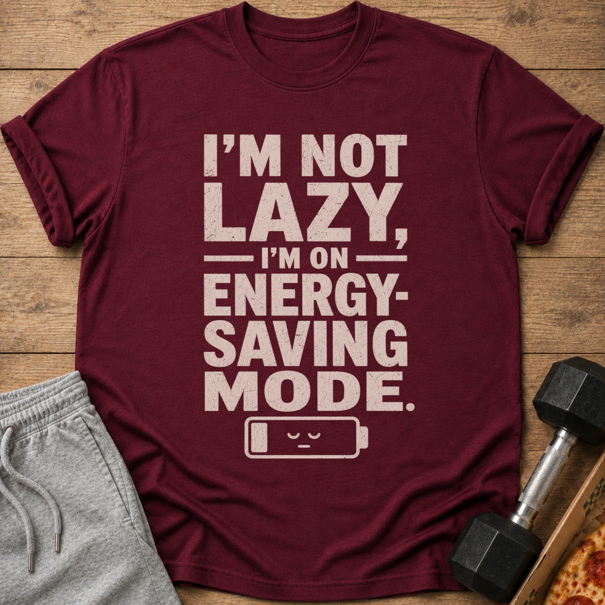 Maroon t-shirt with "I'M NOT LAZY, I'M ON ENERGY-SAVING MODE" text.