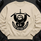 Crewneck sweatshirt with a black graphic of a sloth holding a barbell and the text "Snooze Button Athlete."