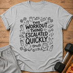 Grey t-shirt with "This Workout Thing Escalated Quickly" text and workout icons.