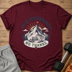 Maroon t-shirt with "Peak Performance? No Thanks." graphic featuring mountains, bench, and sign.