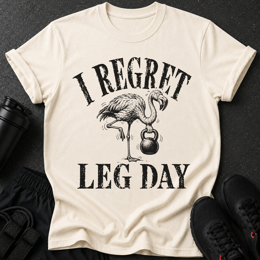 T-shirt with flamingo lifting kettlebell and text "I REGRET LEG DAY".
