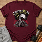 Maroon t-shirt with "Every Day is Leg Day" skeleton graphic and weight plates.