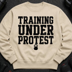 Light beige sweatshirt with black distressed text and kettlebell graphic.