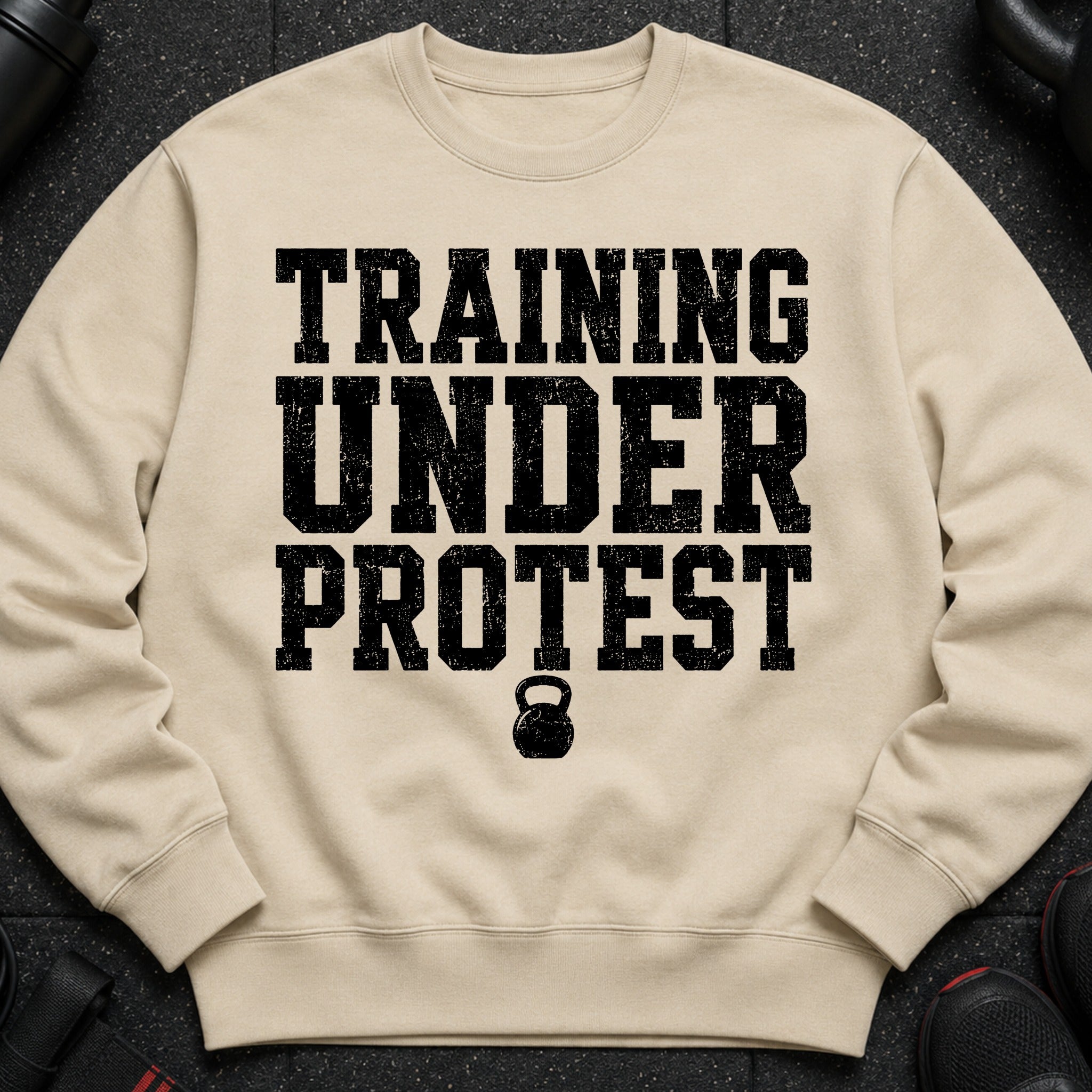 Light beige sweatshirt with black distressed text and kettlebell graphic.