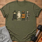 Frog wizard, ghost, cat pumpkin, and skeleton lifting weights on t-shirt.