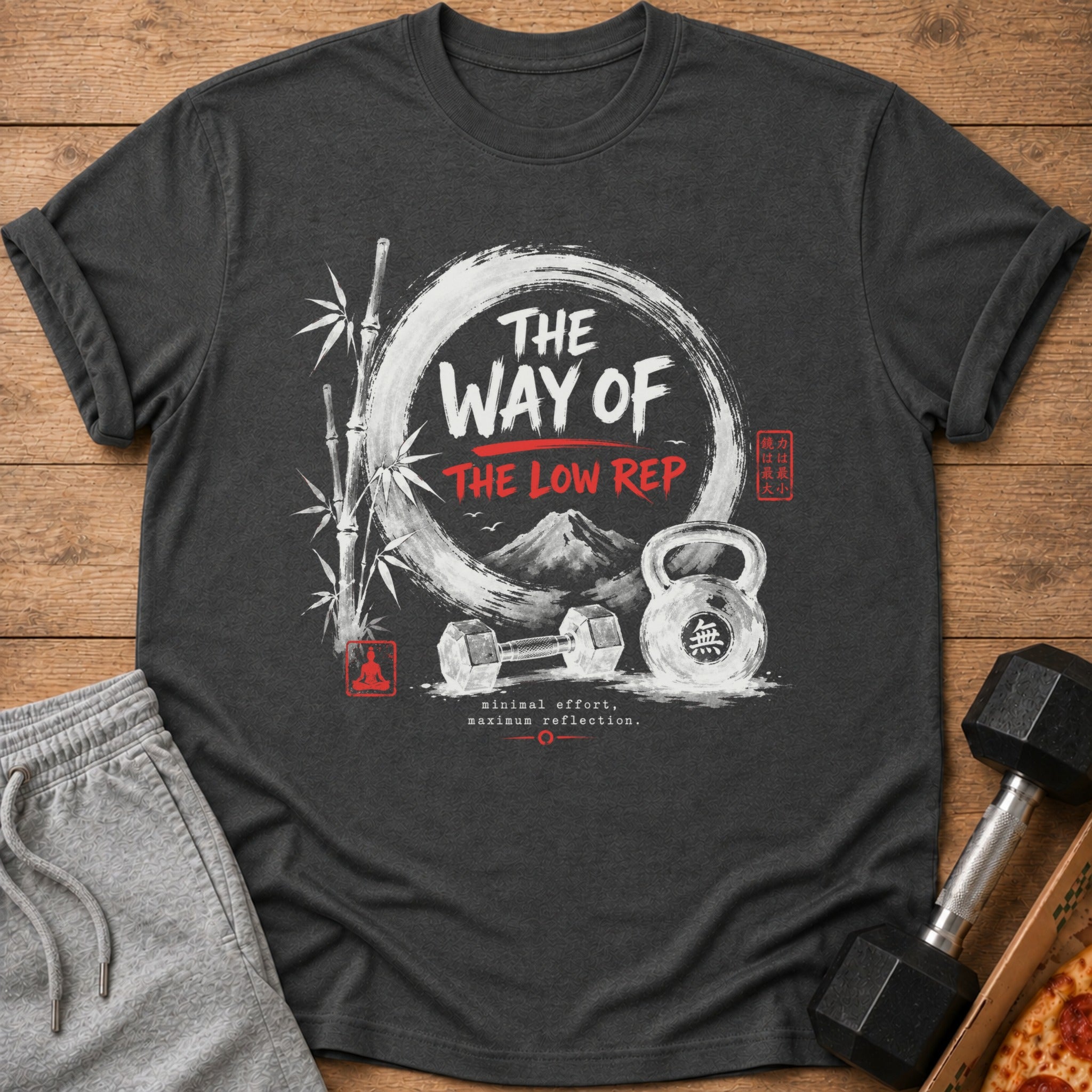Dark t-shirt with "The Way of The Low Rep" text, bamboo, mountains, dumbbell, and kettlebell.