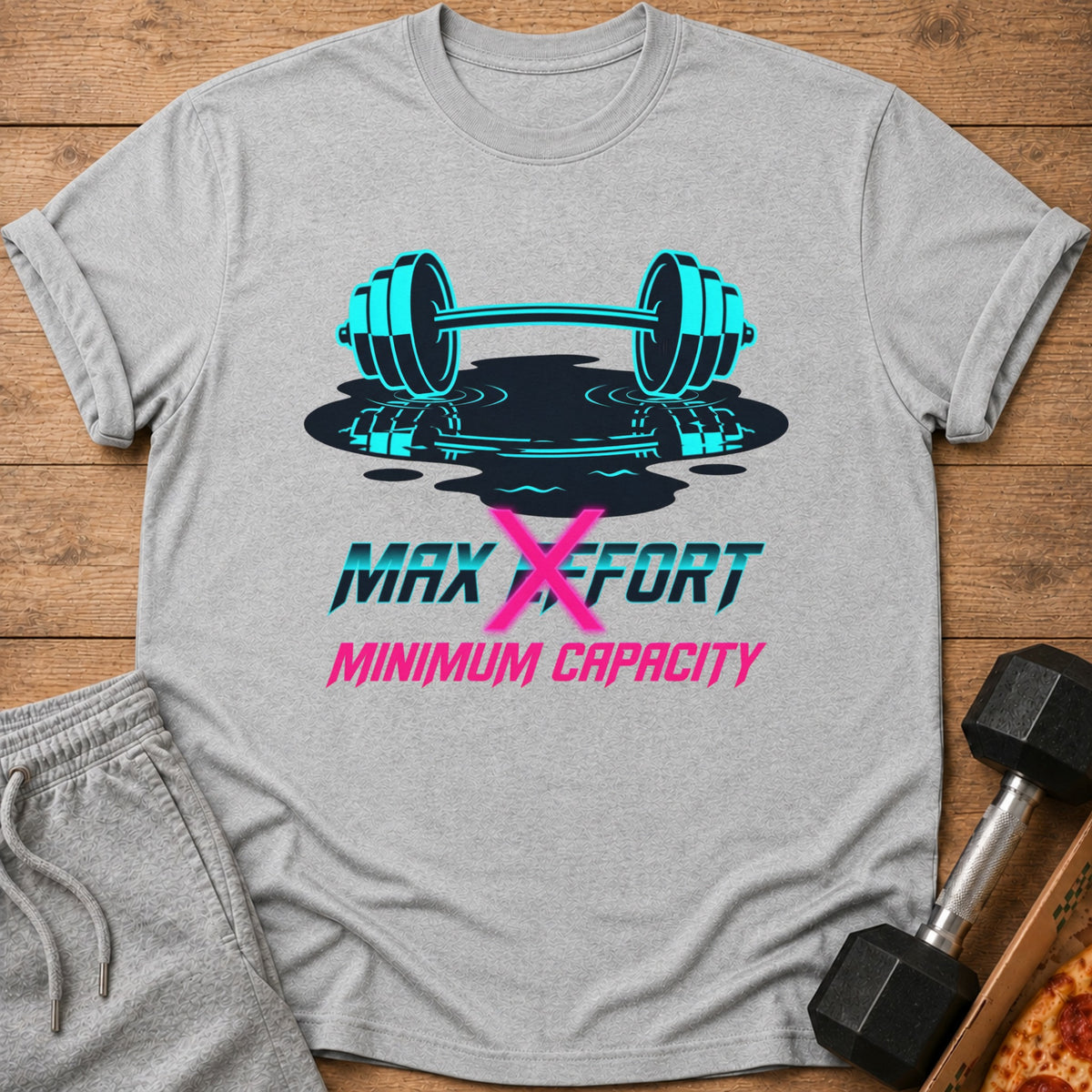 Gray t-shirt with barbell graphic and text "MAX EFFORT MINIMUM CAPACITY".
