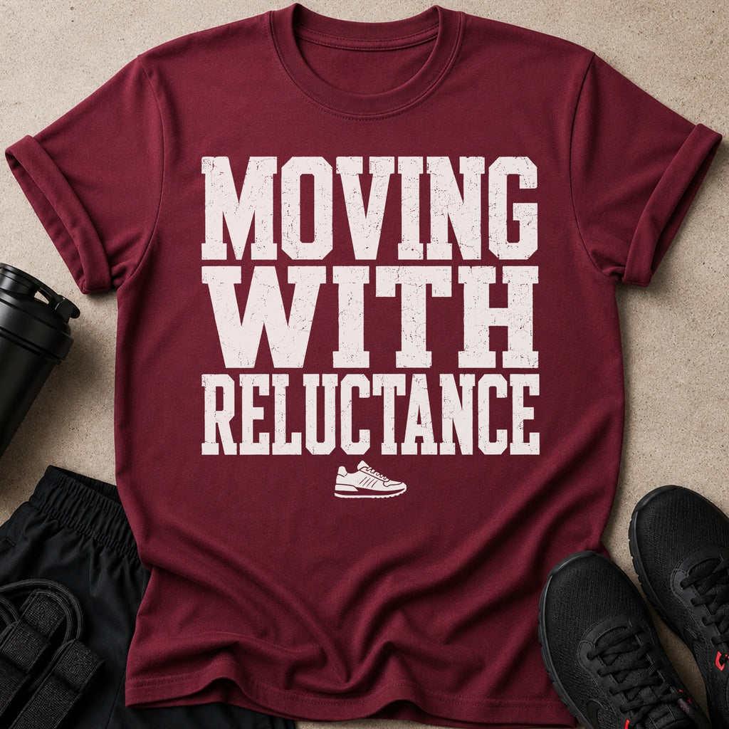 Maroon t-shirt with white text "MOVING WITH RELUCTANCE" and a sneaker graphic.