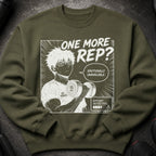 Green sweatshirt with anime design: man lifting weight, "One More Rep?" text.