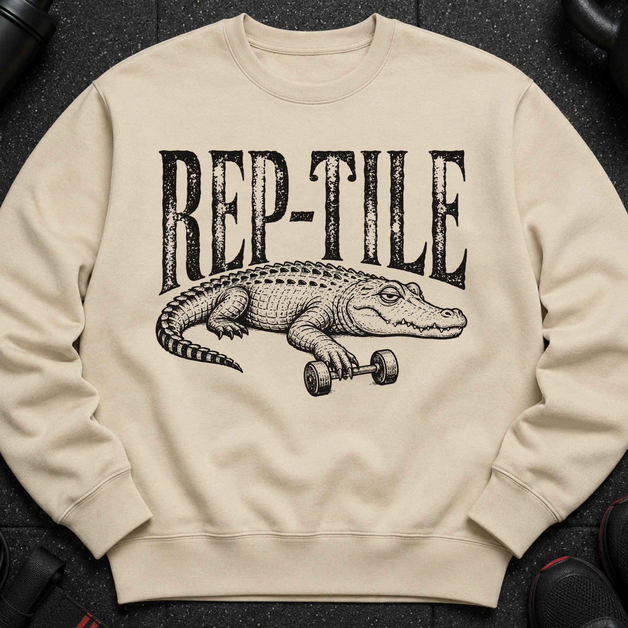Crewneck sweatshirt with black text "REP-TILE" and an alligator holding a dumbbell.