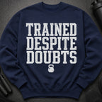 Navy sweatshirt with "TRAINED DESPITE DOUBTS" text and kettlebell graphic.