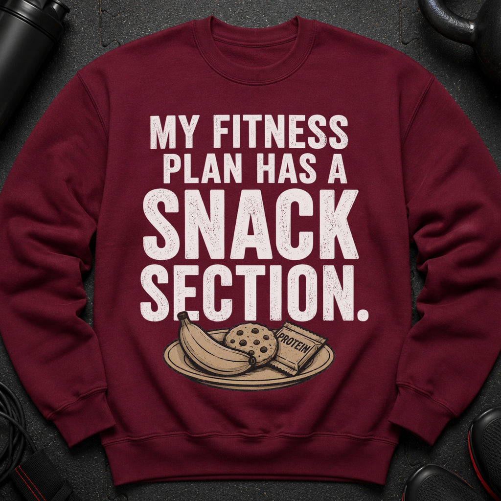 Maroon sweatshirt with text "MY FITNESS PLAN HAS A SNACK SECTION" and image of snacks.