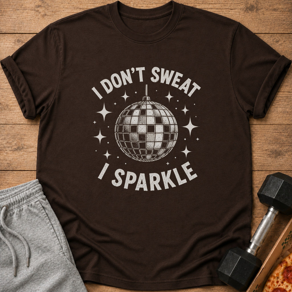 Brown t-shirt with disco ball graphic and text "I DON'T SWEAT I SPARKLE."