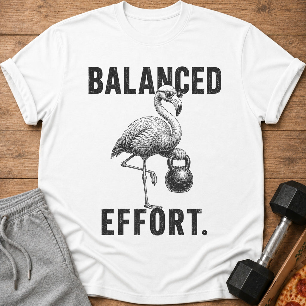 White t-shirt with flamingo lifting kettlebell and text "BALANCED EFFORT".
