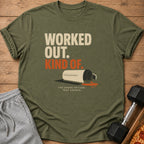 Olive green t-shirt with text "WORKED OUT. KIND OF." and spilled shake graphic.