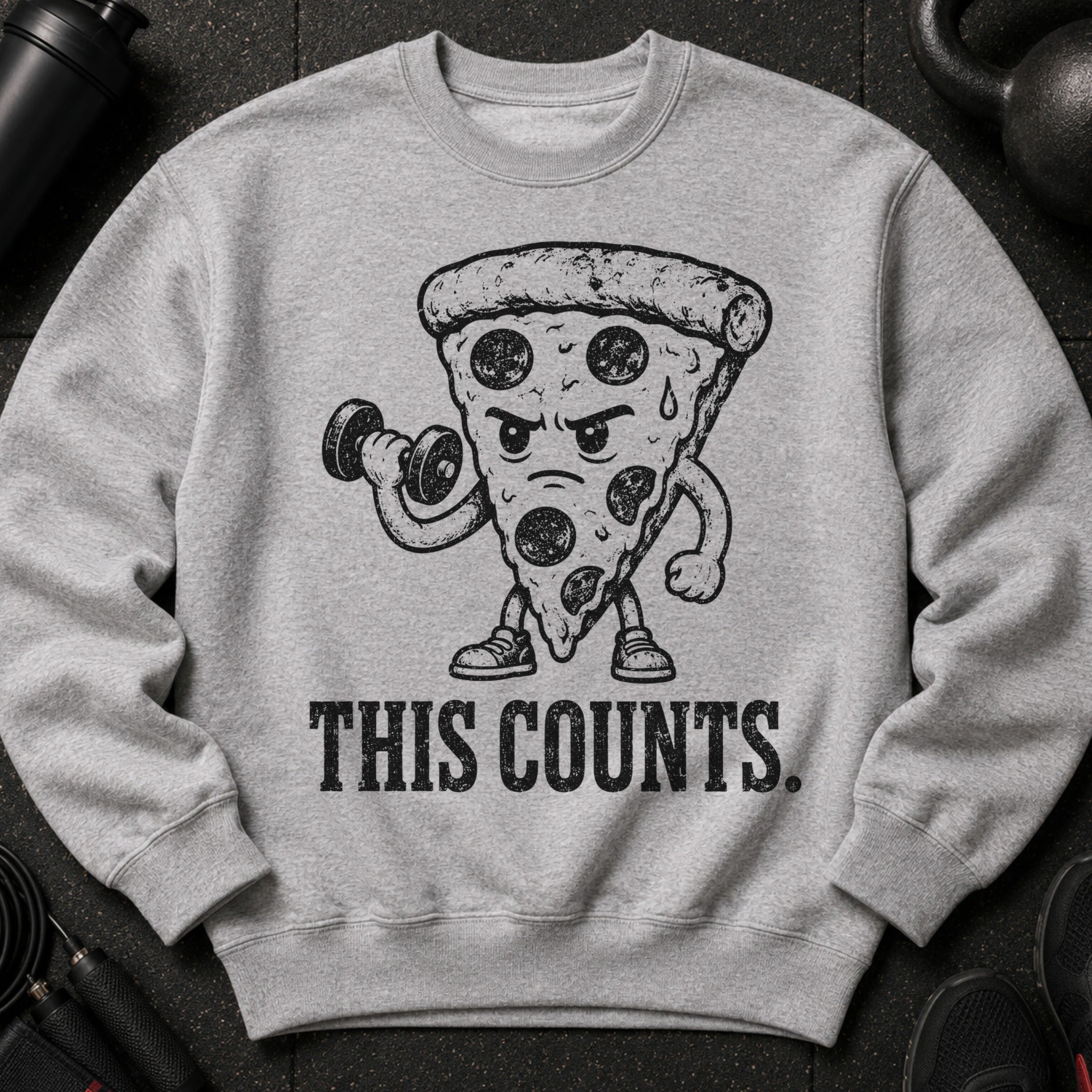 Sweatshirt with illustration of a pizza slice lifting a dumbbell and text "THIS COUNTS."