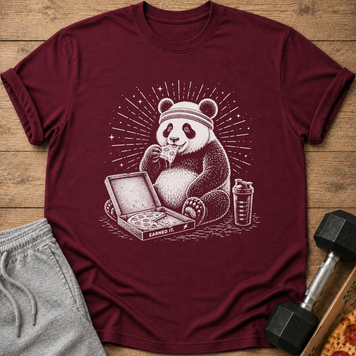 Panda wearing headband eats pizza from box with text "Earned It."