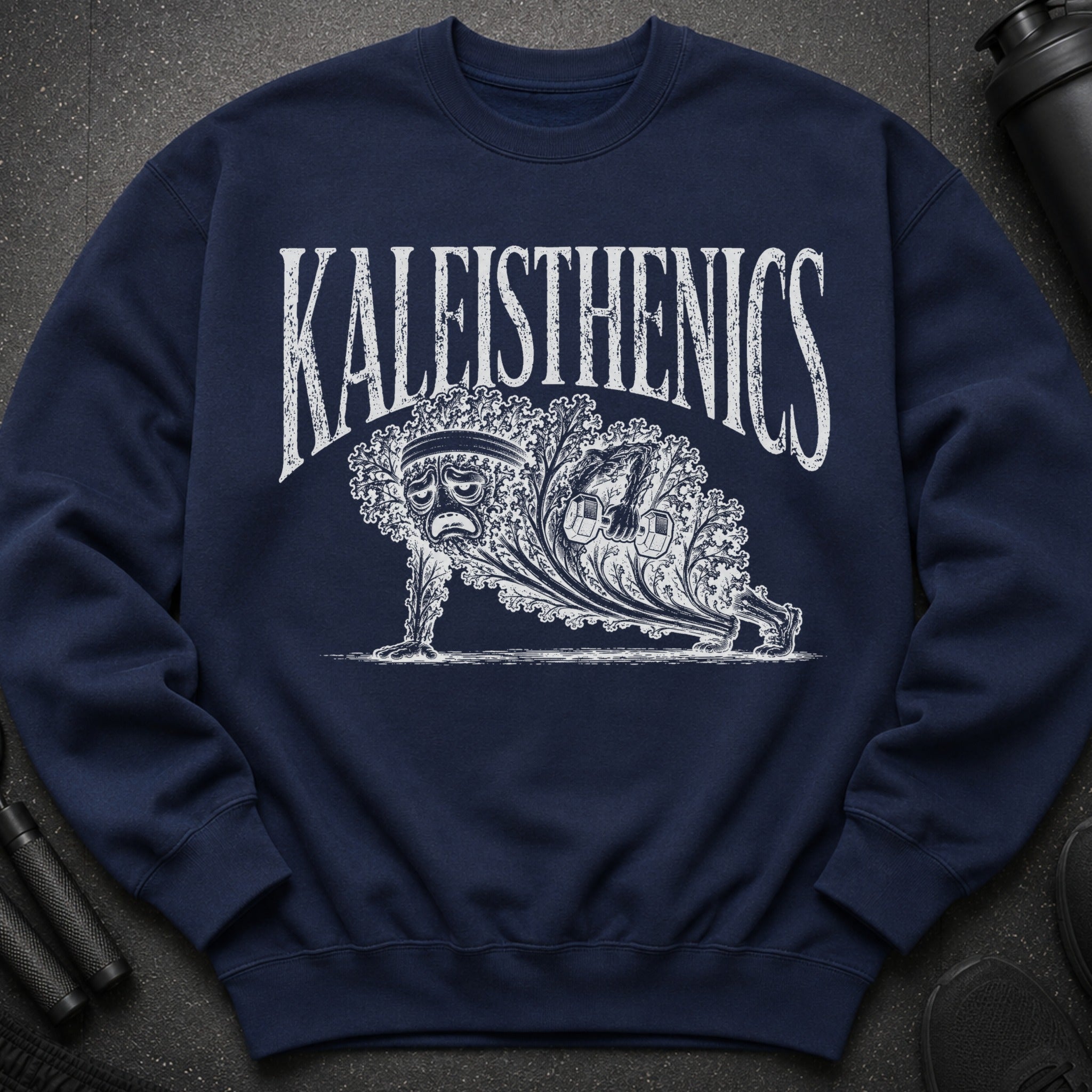 Navy sweatshirt with distressed white "KALEITHENICS" text and an illustration of a kale figure doing a plank.