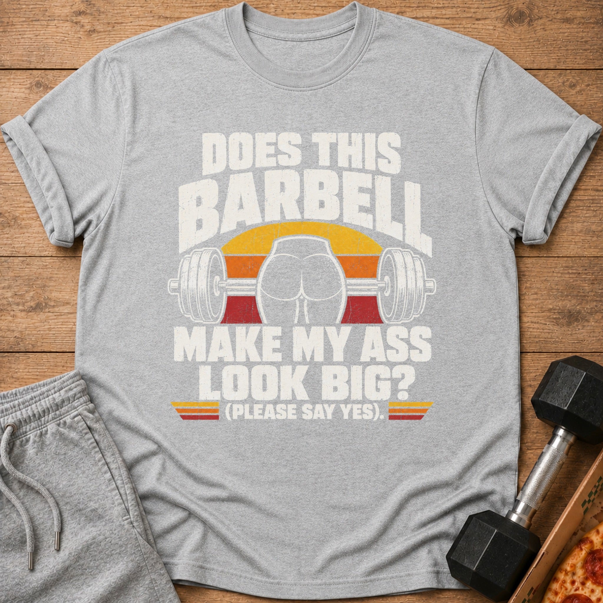 Grey t-shirt with "Does this barbell make my ass look big? (Please say yes.)" graphic.