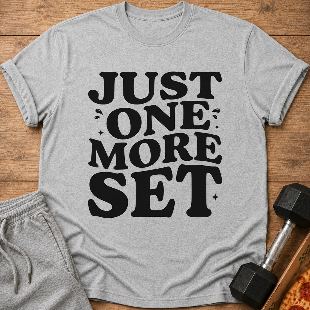 Gray t-shirt with black text "JUST ONE MORE SET" alongside workout gear.