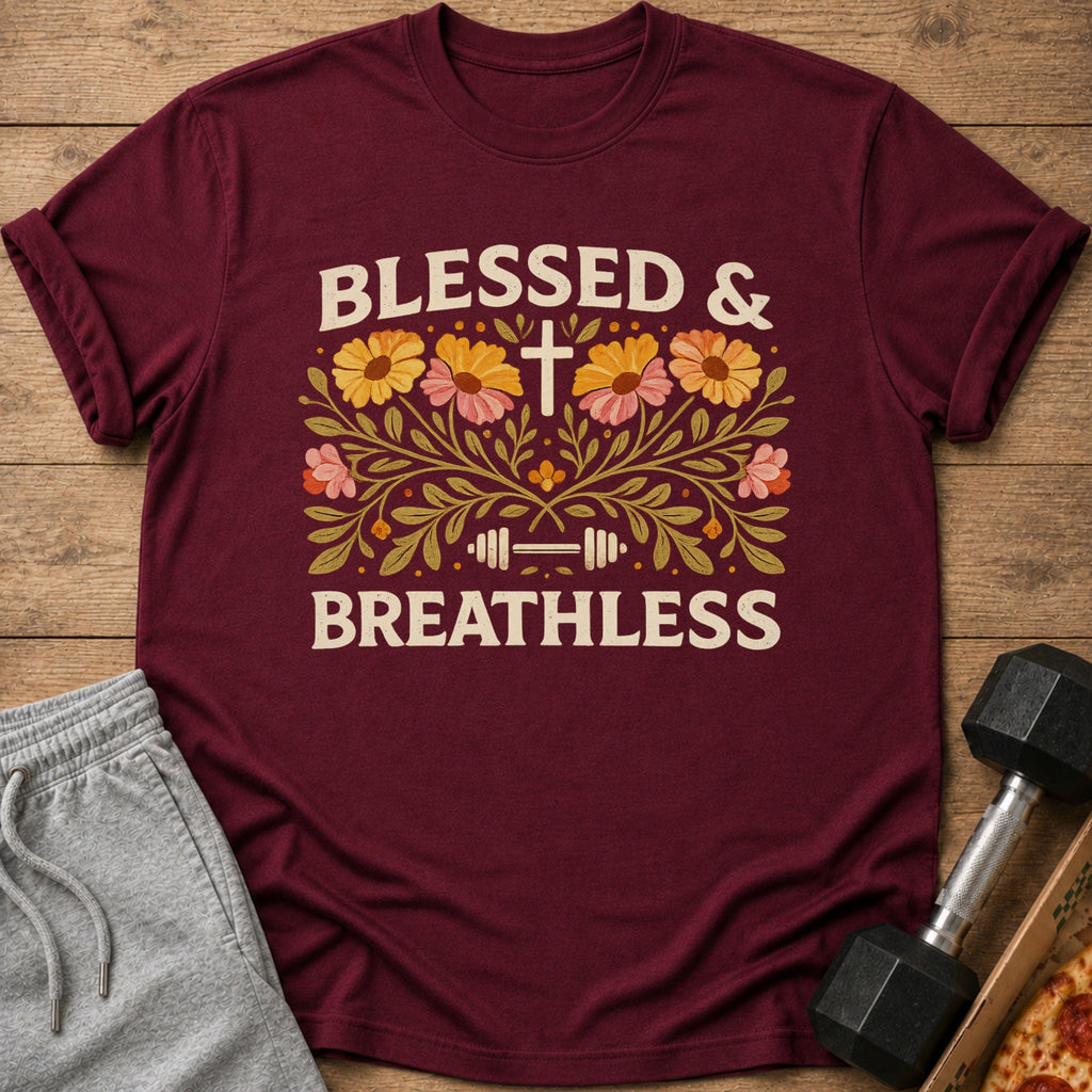 Maroon t-shirt with "BLESSED & BREATHLESS" text, cross, barbell, and floral design.