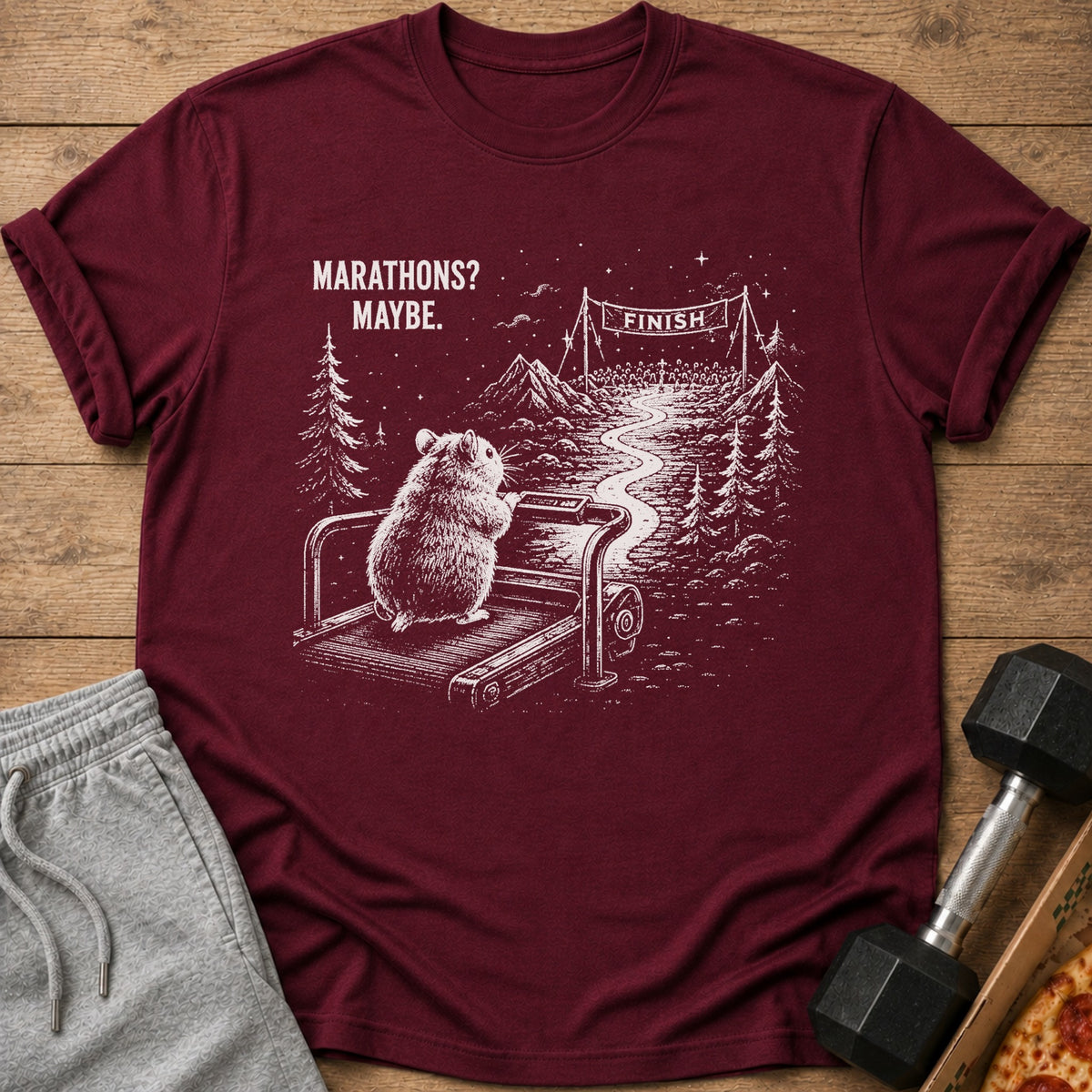 Maroon t-shirt with hamster on treadmill and "Marathons? Maybe." text.