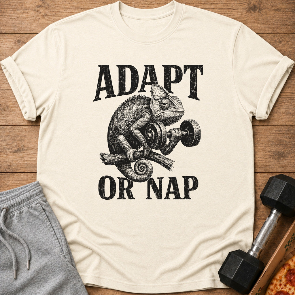 Chameleon lifting dumbbell with text "ADAPT OR NAP" on a cream t-shirt.