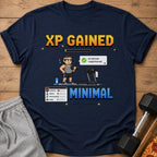 T-shirt with pixel art of a person on a treadmill, "XP GAINED" text, and stats.