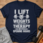 Navy t-shirt with white distressed text and barbell graphic: "I lift weights because therapy has opening hours."