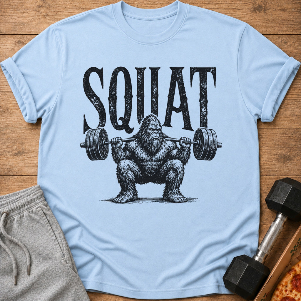Light blue t-shirt with Bigfoot text art and a weightlifter Bigfoot.