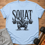 Light blue t-shirt with Bigfoot text art and a weightlifter Bigfoot.