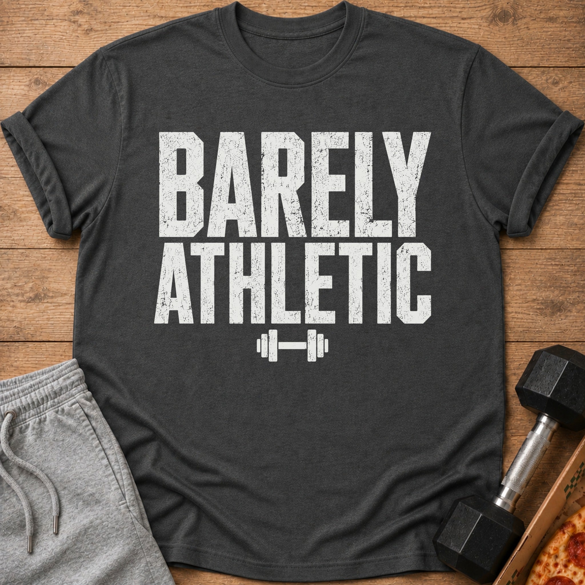 Charcoal t-shirt with distressed white text "BARELY ATHLETIC" and barbell graphic.