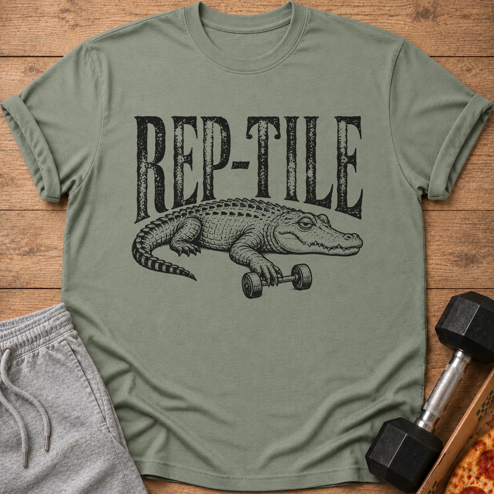 Green t-shirt with "REP-TILE" text and alligator lifting dumbbell graphic.