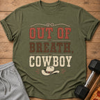 Olive green t-shirt with distressed text "OUT OF BREATH, COWBOY" and cowboy hat graphic.