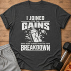 Dark grey t-shirt with white text "I JOINED FOR THE GAINS AND STAYED FOR THE BREAKDOWN".