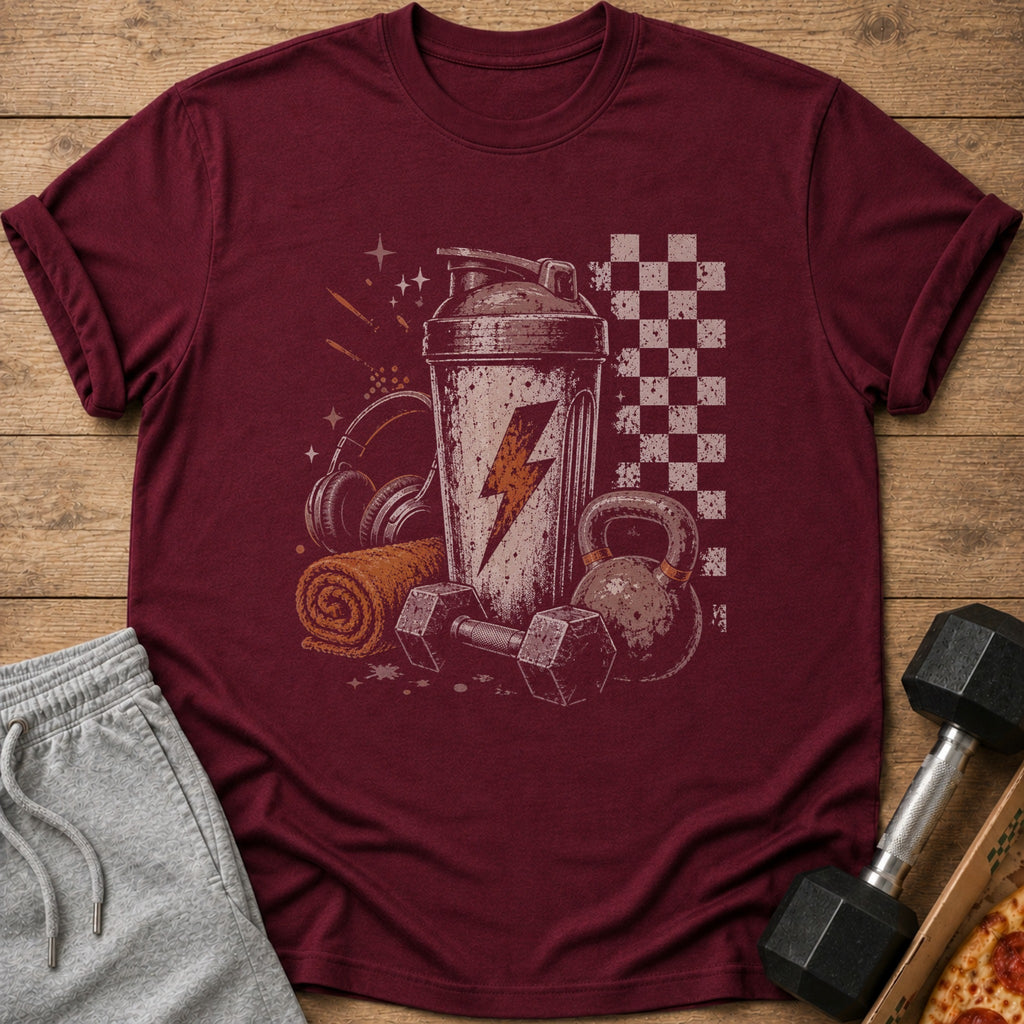 Maroon t-shirt with graphic of gym equipment and lightning bolt.