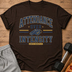 Brown t-shirt with "ATTENDANCE OVER INTENSITY ANTI-HUSTLE" text and whistle graphic.