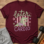 Burgundy t-shirt with cartoon alligator saying "Later Cardio" and carrying a gym bag.
